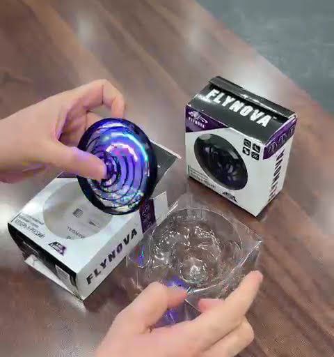 Hand-operated flying spinner mini- drone toy